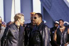 Dogg (KID ROCK, center left) challenges Smoke (LAURENCE FISHBURNE, center right) to a race as Soul Train (ORLANDO JONES, far left) and Motherland (DJIMON HOUNSOU, center) look on.