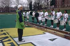 Director Charles Stone reviews his "troops" on the set of DRUMLINE