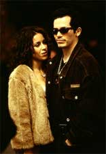 Victor Rosa (John Leguizamo) and his girlfriend Carmen (Delilah Cotto) in Universal's Empire -