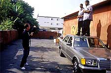 Director Marcus Raboy with Mike Epps and Ice Cube on the set of New Line's Friday After Next - 2002
